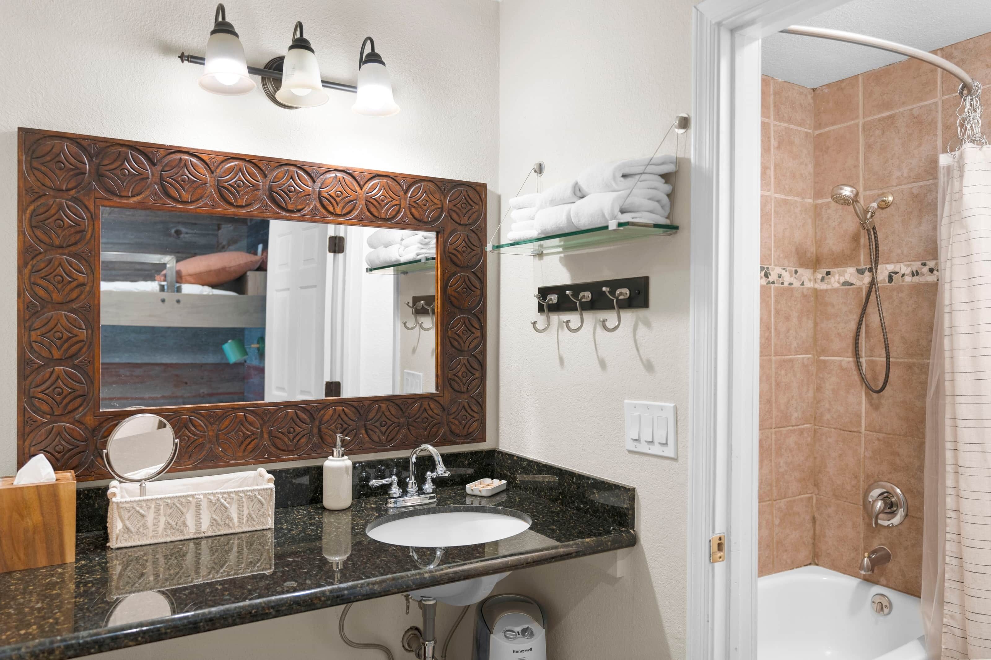 Bathtub, eco-friendly toiletries, hair dryer, towels