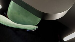 A close-up of a car seat with a green cover and a metallic trim. - Rugs Hotel Augsburg, Trademark Collection by Wyndham (Augsburg)