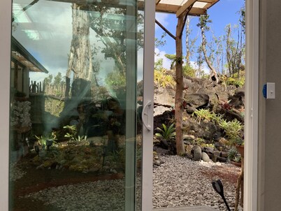 Exotic garden cottage  at amazing volcanic fissure