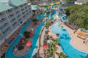 Outdoor pool, a heated pool - Rare waterfront 2Bd/2Ba, 2 Balcony Top Floor End Unit w/4 Daily Waterpark Passes (Indian Rocks Beach)