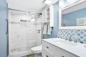 Shower, hair dryer, towels, soap