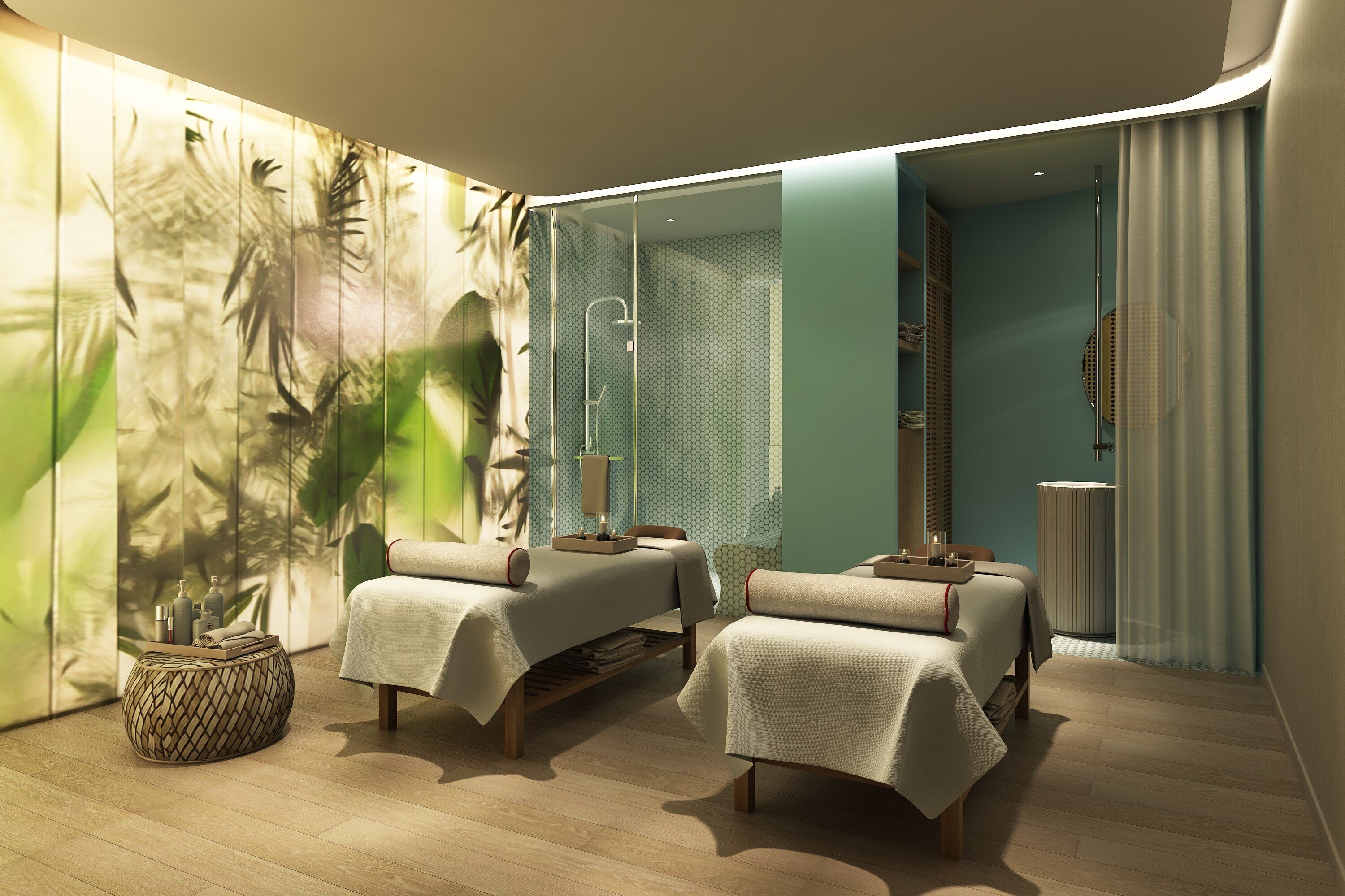 A modern spa room with two massage tables, a shower area, and a large mirror.