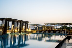 Outdoor pool, open 7:00 AM to 7:00 PM, pool umbrellas, pool loungers - Holiday Inn Lucknow Airport by IHG (Lucknow)