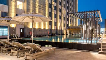 Outdoor pool, open 7:00 AM to 7:00 PM, pool umbrellas, pool loungers