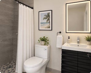 A bathroom with a toilet, a shower curtain, a sink with a mirror, and a framed picture on the wall.