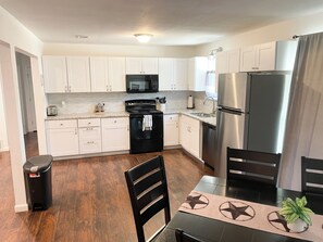 Full-sized fridge, microwave, oven, dishwasher