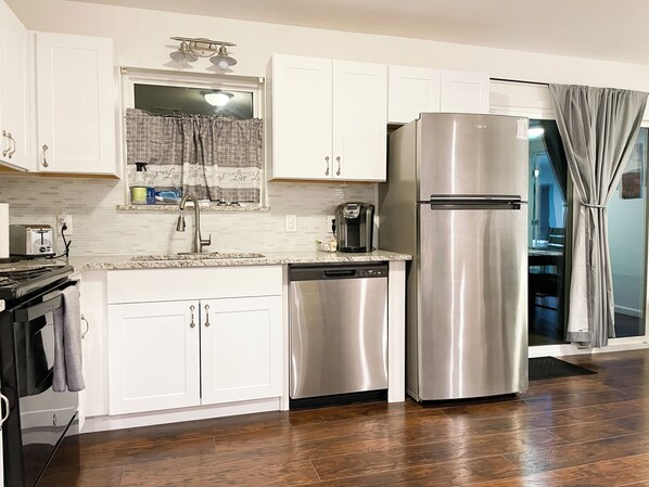 Full-sized fridge, microwave, oven, dishwasher