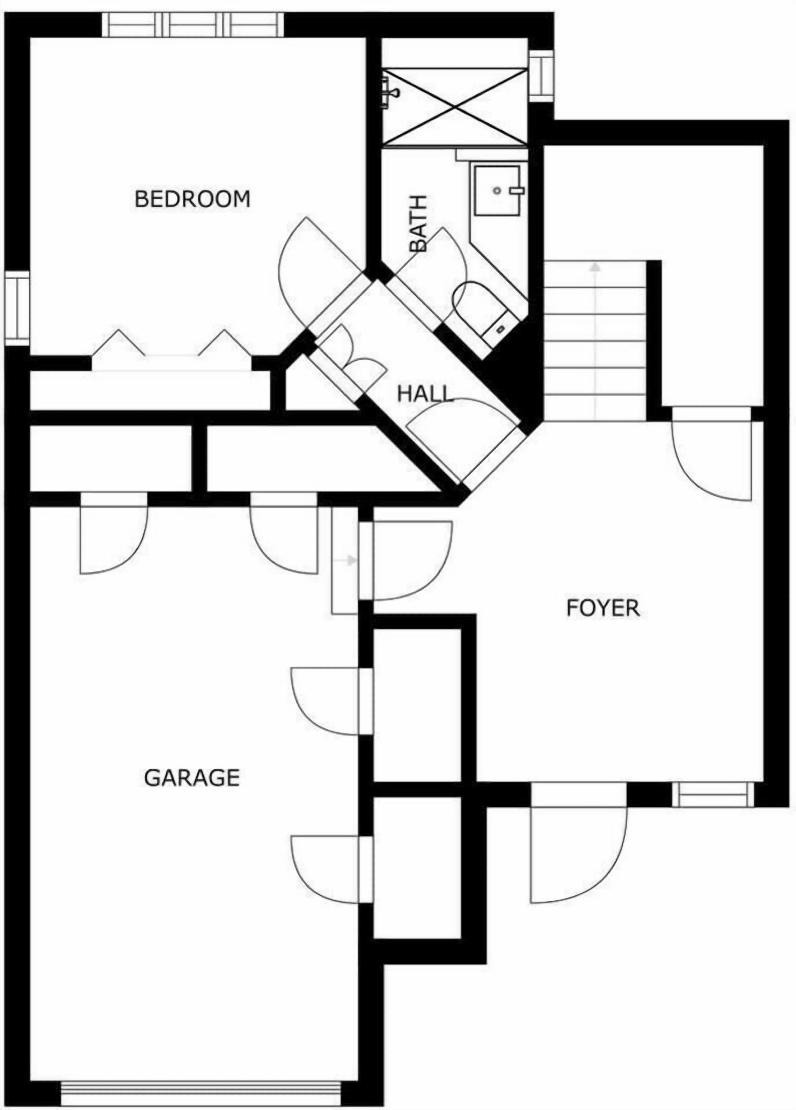En planritning som visar ett sovrum, badrum, hall, entré och garage.