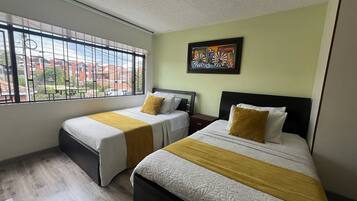 Desk, laptop workspace, free WiFi, bed sheets