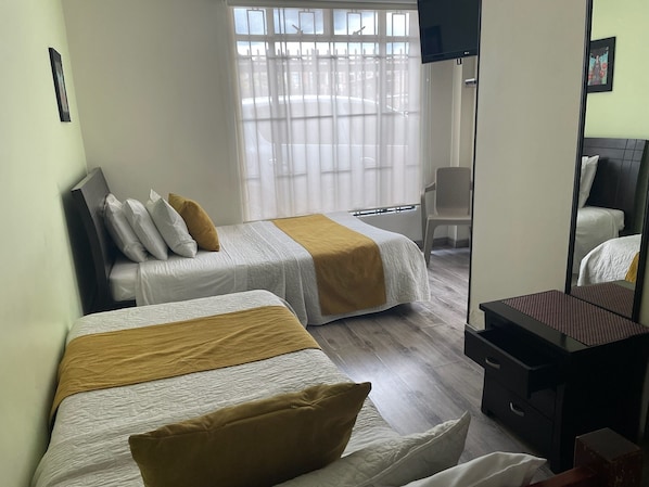 Desk, laptop workspace, free WiFi, bed sheets