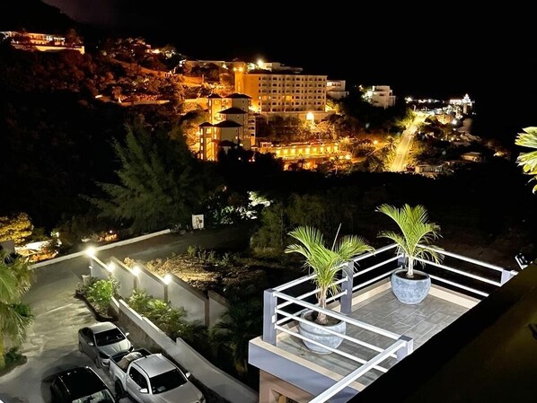 Hotel complex with modern buildings and lush surroundings.