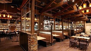 A restaurant with wooden beams, stone pillars, and a bar area. - Grand Lodge Peak 7, Breckenridge 20-27 Dec, ski in/ski out resort 2 Bdrm/2 bath (Breckenridge)