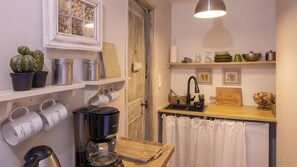 Fridge, microwave, stovetop, coffee/tea maker