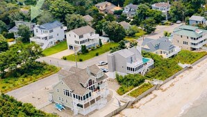 A coastal residential area with houses, a beach, and a road. - Water Views - 3 Min Walk to Private Beach - Luxury 5-Star Rated Beach House (Lower Township)