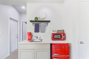 Fridge, coffee/tea maker, cookware/dishes/utensils