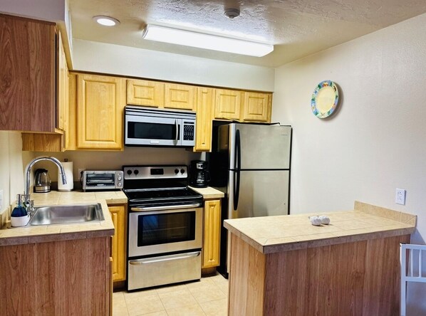 Fridge, microwave, oven, cookware/dishes/utensils