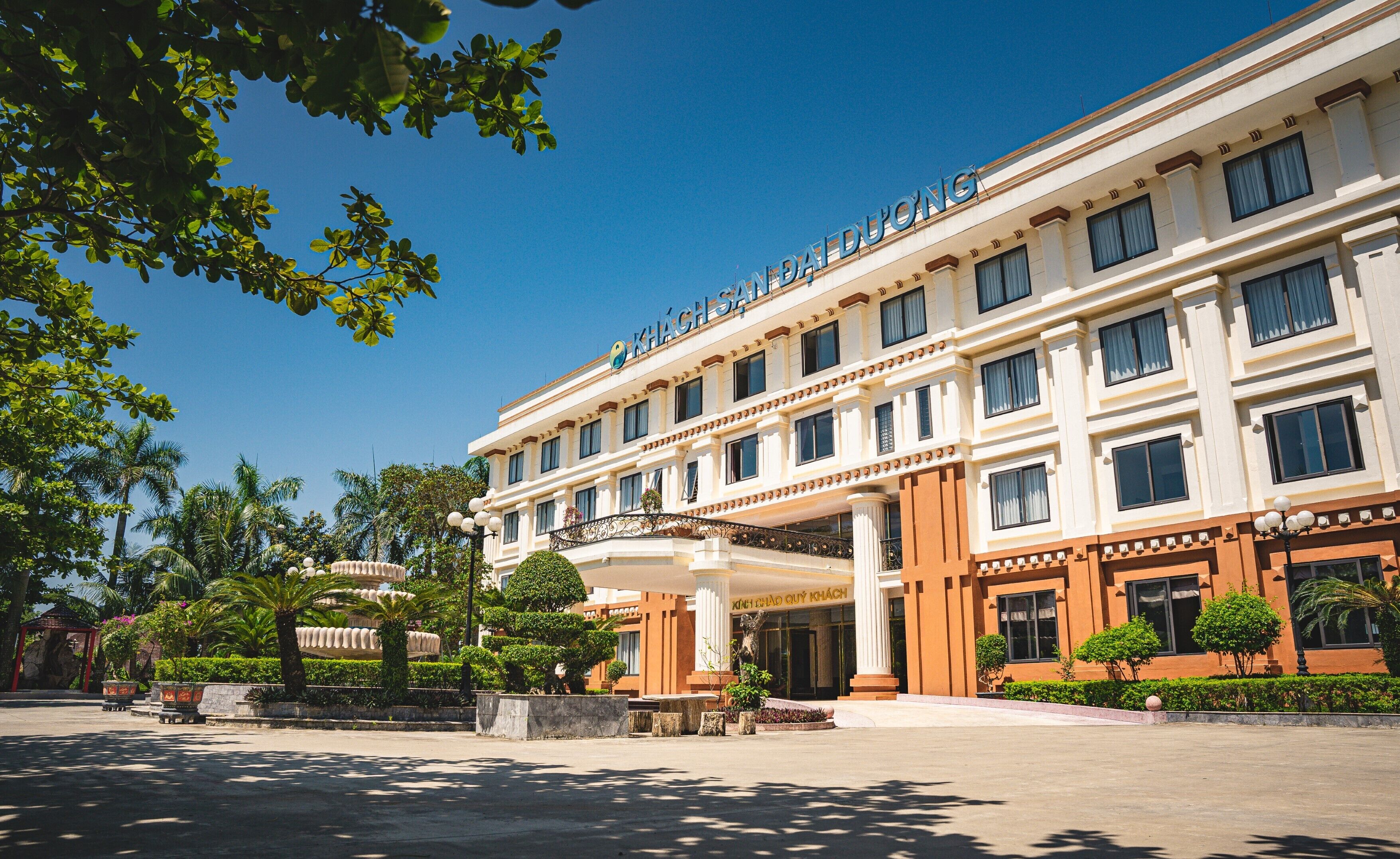 A large, multi-story hotel with a prominent entrance and a covered area.