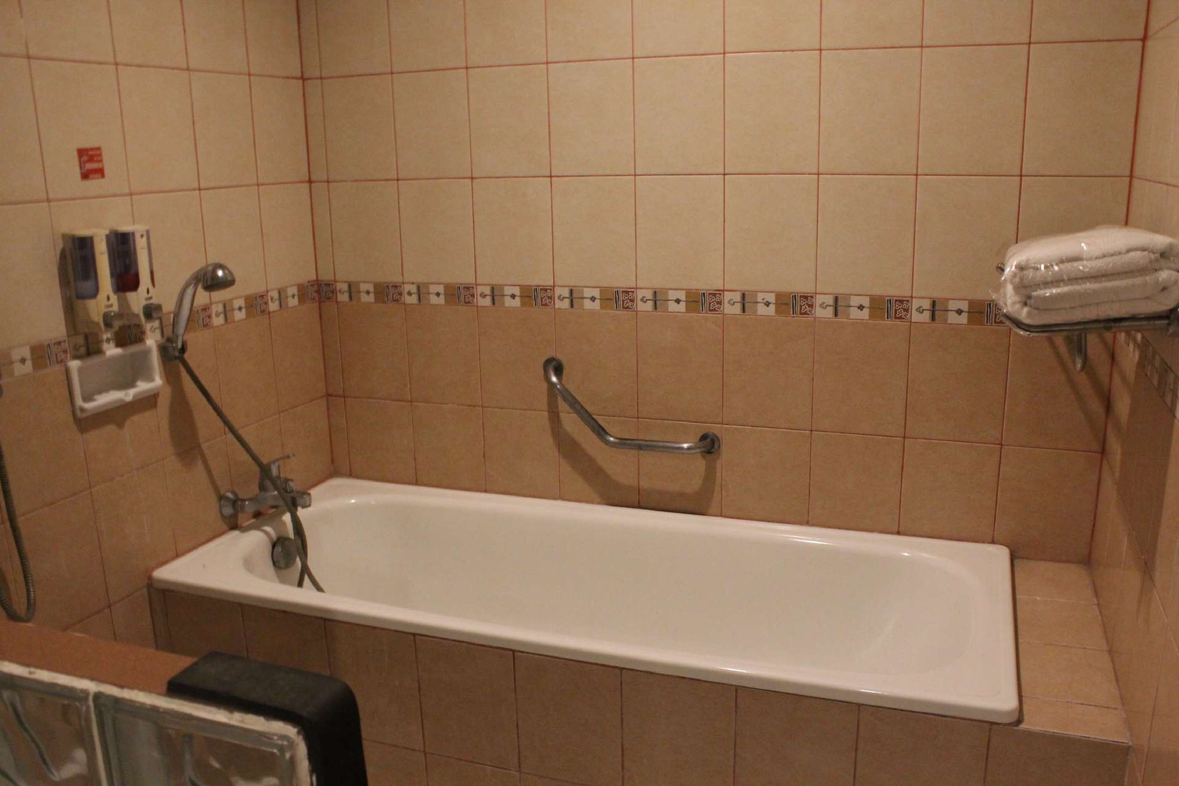 superior studio | bathroom | slippers, towels, soap, shampoo