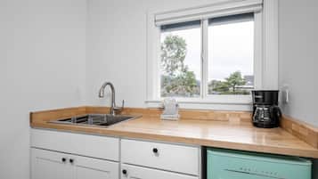 Microwave, coffee/tea maker, dining tables