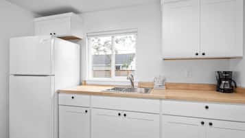 Fridge, microwave, coffee/tea maker, dining tables
