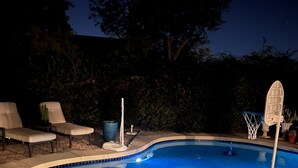 A swimming pool with a curved edge, surrounded by a paved deck. - RENT NOW!! 1st Time NEW Rental Grayhawk Luxury Home Near TPC Scottsdale Shopping (Scottsdale)
