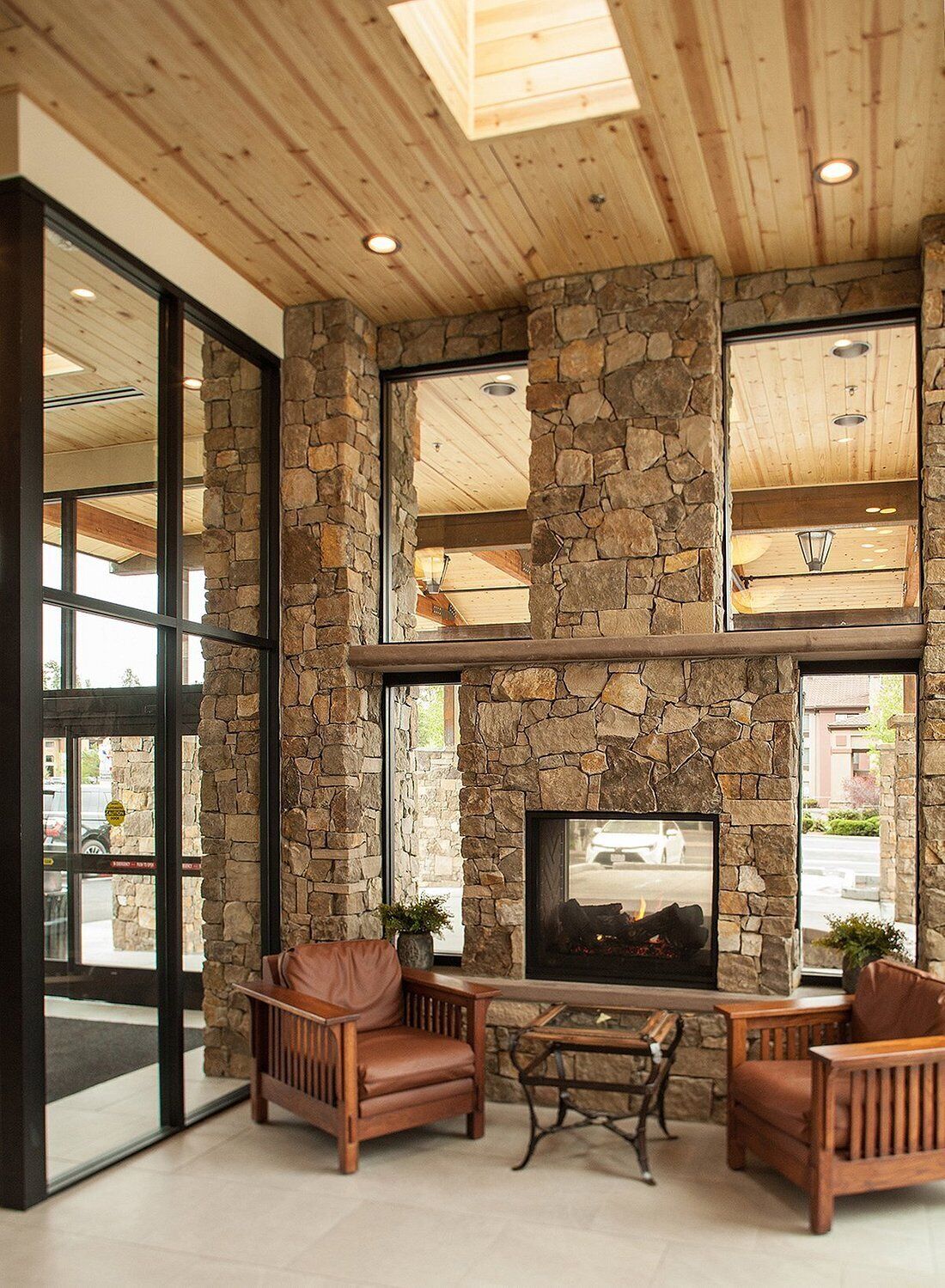Unwind by the soaring stone fireplace in airy lobby.
