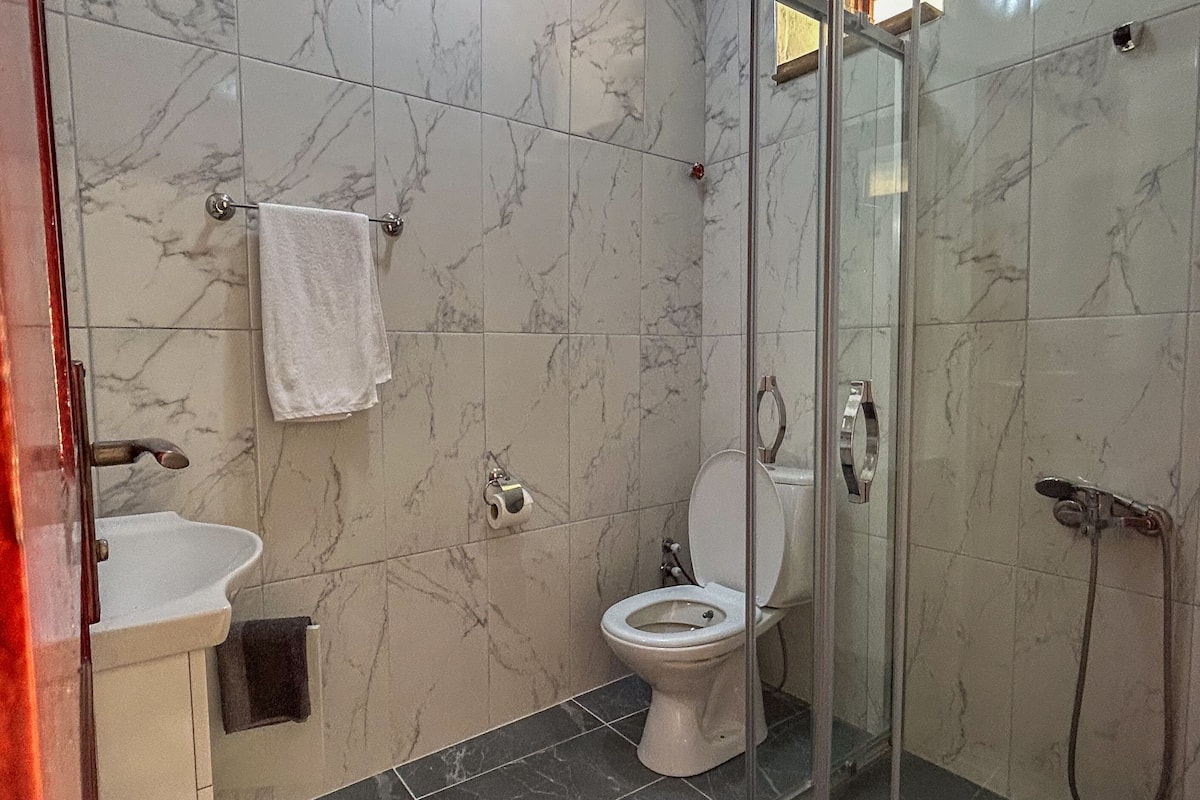 Shower, hair dryer, towels, soap