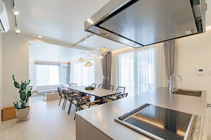 Premium Villa B | Private kitchen | Full-size fridge, microwave, stovetop, electric kettle - Crystal Villa Bayside (Miyakojima)
