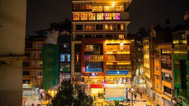 A multi-story hotel with a ground floor restaurant and a visible sign for 'Kumarajiva Limited'. - MeroStay004 (Kathmandu)