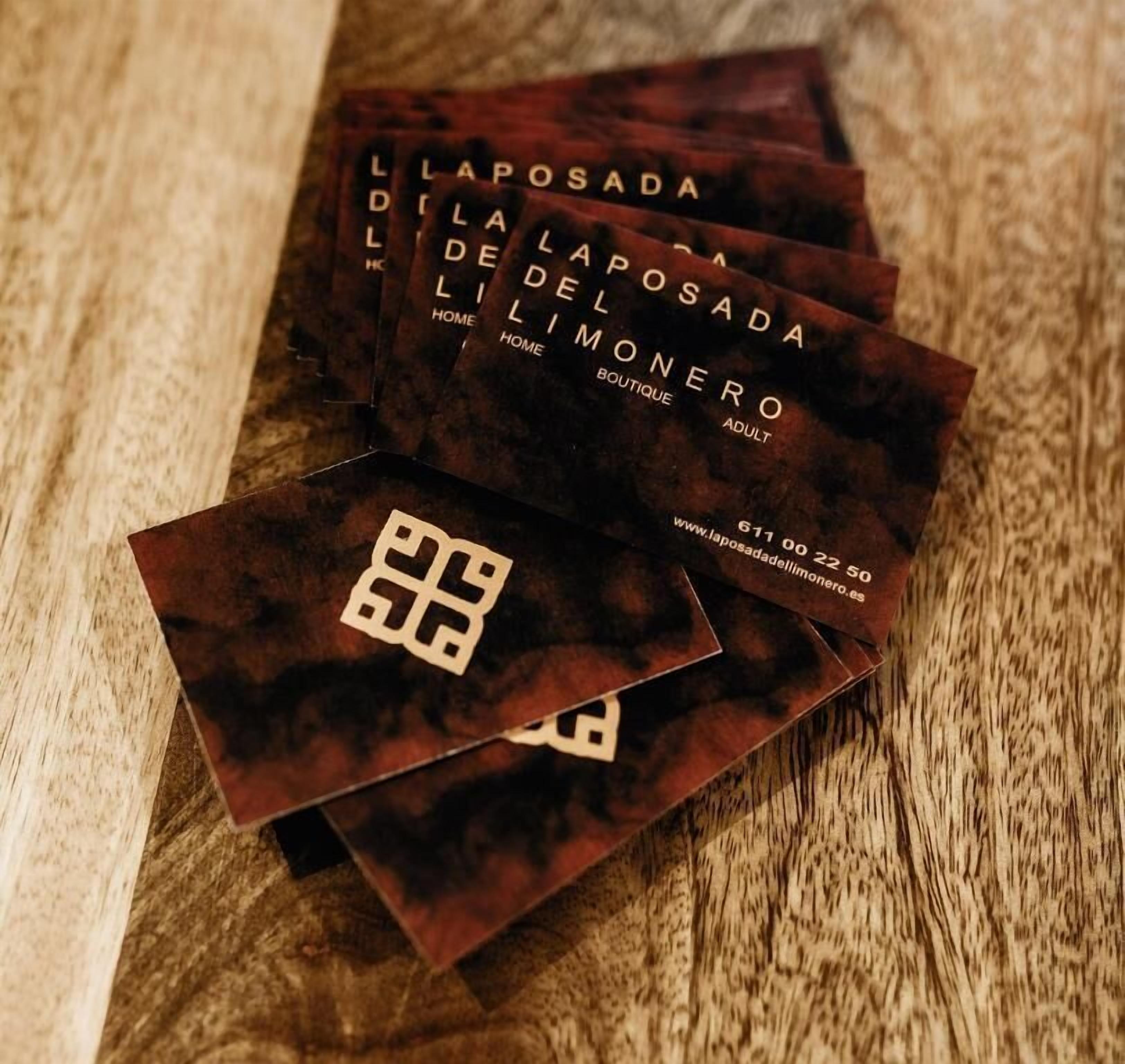 Business cards for L'APOSADA DEL MONERO BOUTIQUE ADULT.