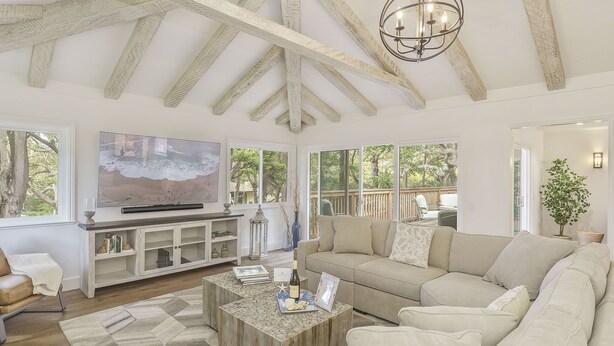 A spacious living room with a large TV, a wooden coffee table, and a beige sectional sofa. - 3877 Sea Esta~ Beautifully Remodeled, Near Golfing (Pebble Beach)