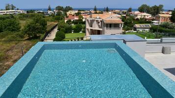 Seasonal outdoor pool, pool umbrellas, sun loungers