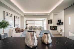 Agnadio Suite | Living area | 40-inch Smart TV with satellite channels, TV, fireplace - Balia Suites (Corfu)