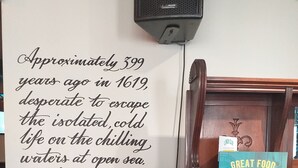 A wall with a historical quote and a menu board for the Old Ship Inn. - Old Ship Inn (Dorchester)