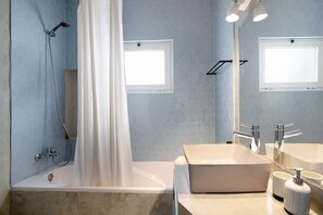 Bathtub, hair dryer, towels