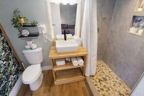 Shower, hair dryer, towels, shampoo