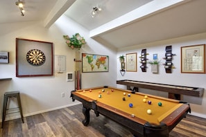 A billiards table with balls, a dartboard, and framed pictures on the walls. - Pub -  Hot Tub - Fire Pit (Green Mountain Falls)