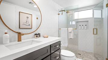 Shower, hair dryer, towels, soap