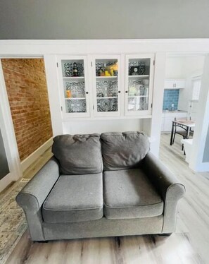 Relax in this inviting living space with a comfortable sofa and stylish cabinet.