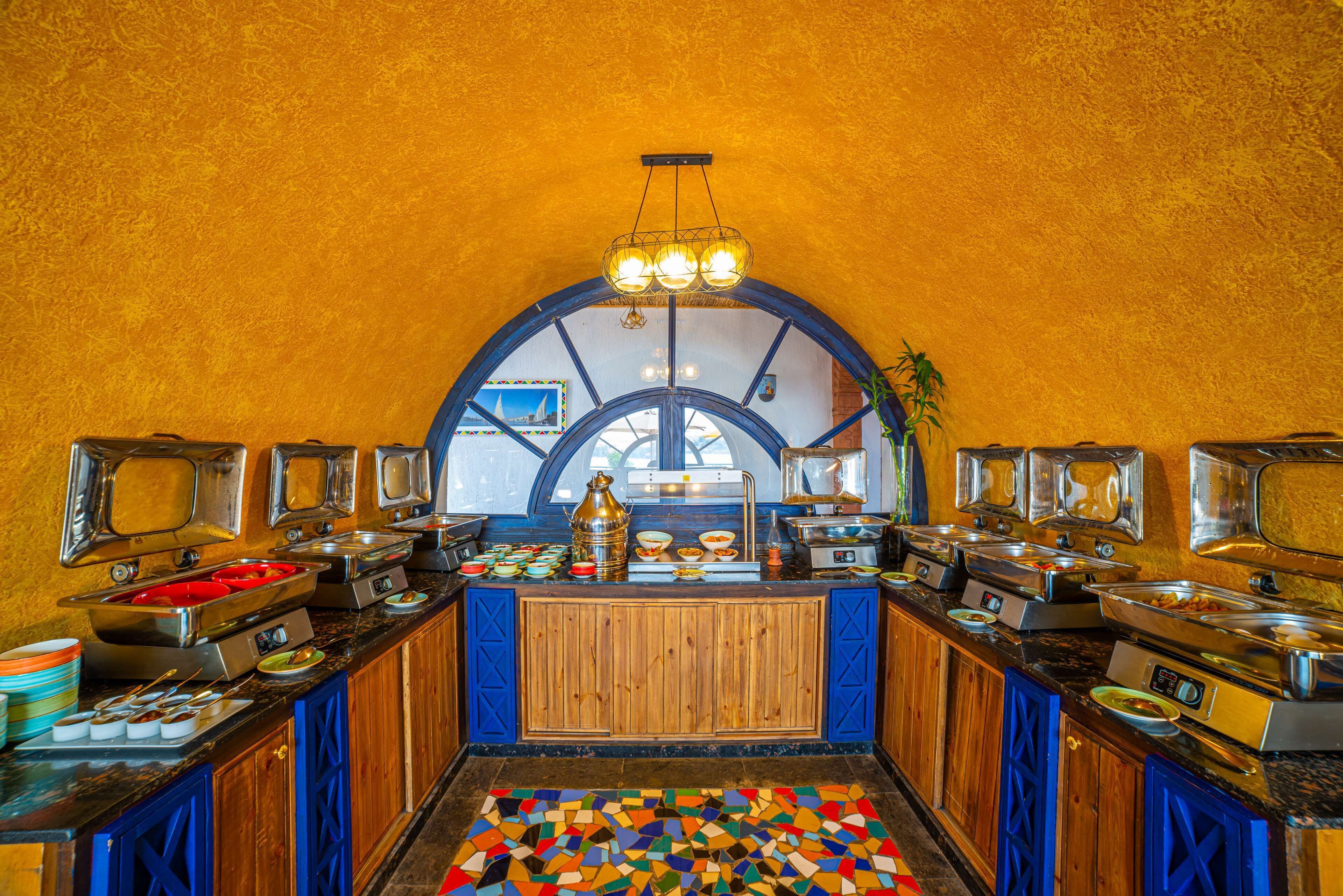 A buffet with multiple food stations and a central serving area.