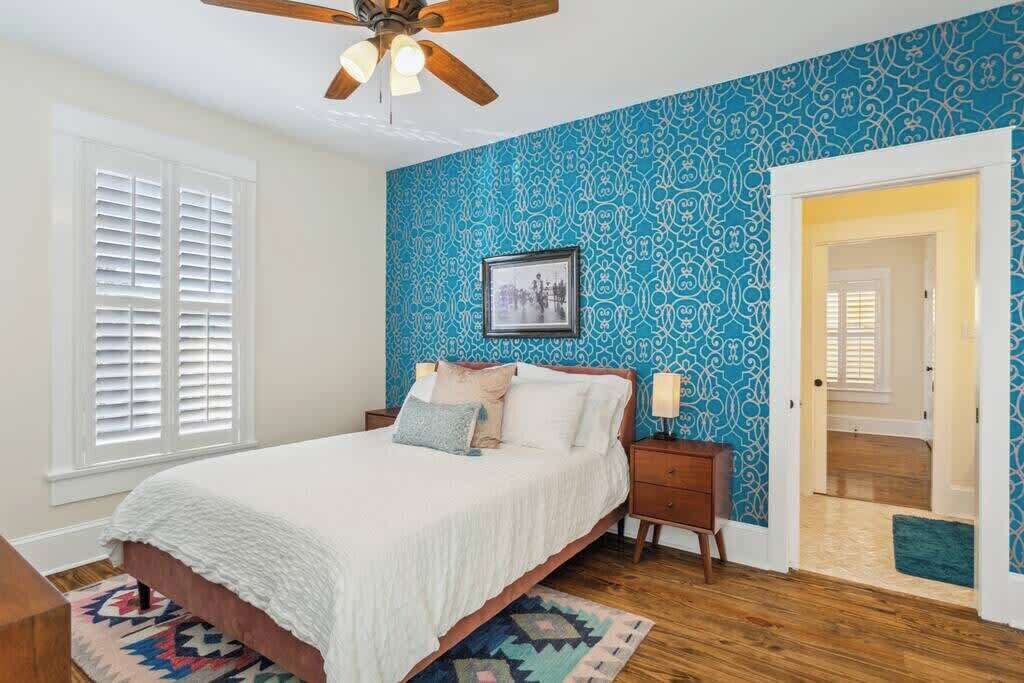 Bright bedroom with a comfortable bed and cheerful design, offering a relaxing place to rest.