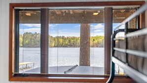 A window with a view of a lake and forest. - 2  Lake Cabins & Saunа & Access to Trails (Eagle River)