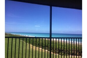 Enjoy breathtaking views of the calm sea from this balcony.
