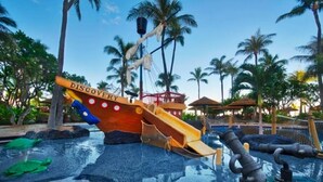 A water play area with a ship-shaped slide labeled "DISCOVERY" and a pool with water features.