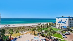 A resort with a pool, beach view, and a building with 'The Island' sign. - 🌊 Gulf Front~Pools~Walk 2 Beach~Beach SVC~2BR Destin West Gulfside 608 (Fort Walton Beach)