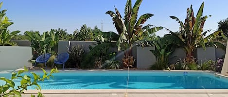 Appartement familial, au bord de la piscine (Studio) | Vue de la chambre