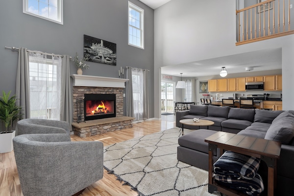 Spacious living room with fire place and lots of seating