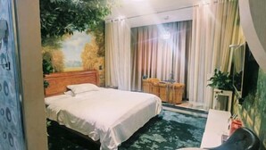 A bedroom with a bed, a desk, a chair, a small table, and a window with curtains. - Yimengshu Hotel (Lichuan)