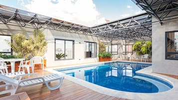 Indoor pool, open 6:30 AM to 10:00 PM, pool loungers