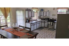 Fridge, cookware/dishes/utensils, dining tables